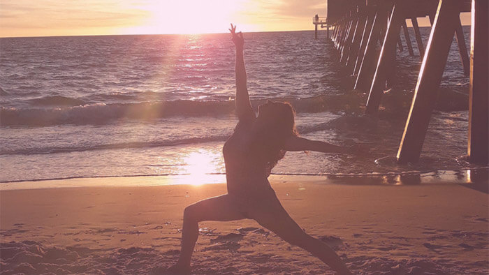 Movement practice at sunrise on the beach — awareness in motion